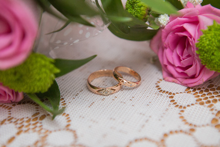 Two wedding rings and spring blossoms. Wedding concept.の写真素材