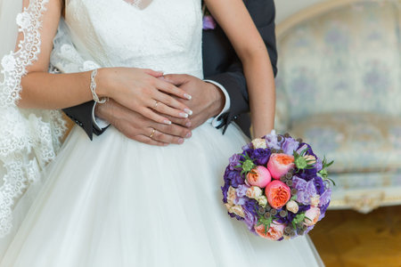 wedding bouquet in hands of the bride