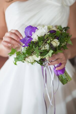 wedding bouquet in hands of the brideの写真素材