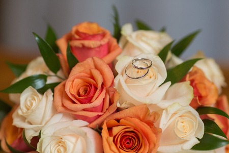 Two wedding rings and spring blossoms. Wedding concept.の写真素材