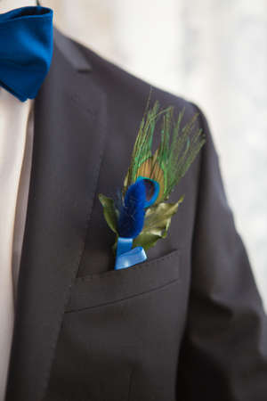 Boutonniere on hip trendy groom at weddingの写真素材