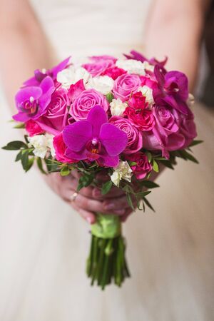 wedding bouquet in hands of the brideの写真素材