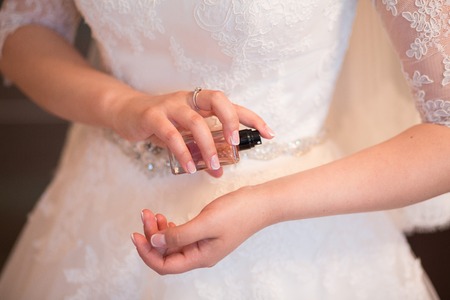 Wedding veil, perfume bottle and a garterの写真素材