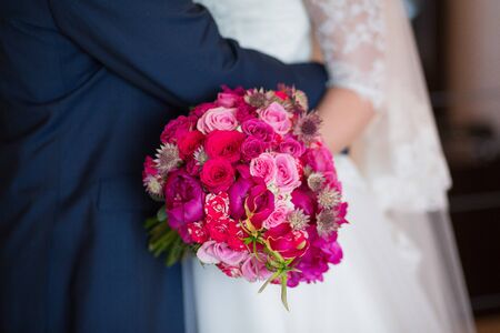 wedding bouquet in hands of the brideの写真素材