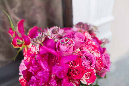 Two wedding rings and spring blossoms. Wedding concept.の写真素材