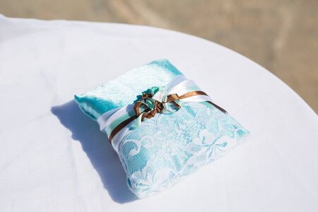 Wedding gold rings on white nice Pillowの写真素材