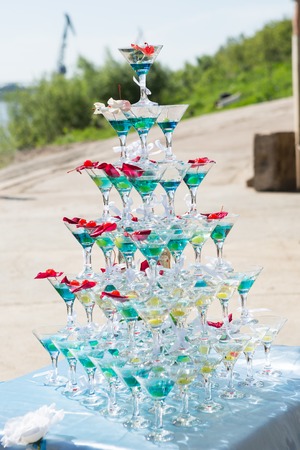 Champagne in glasses with fresh cherry on table - party backgroundの写真素材