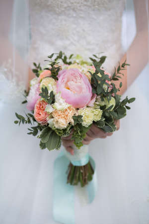 wedding bouquet in hands of the brideの写真素材