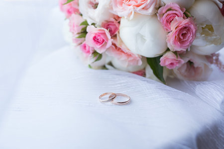 Two wedding rings and spring blossoms. Wedding concept.