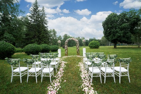 beautiful wedding ceremony in the garden with chairsの写真素材