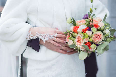 wedding bouquet in hands of the brideの写真素材