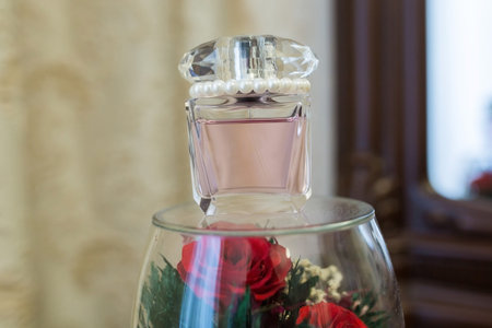 Wedding flower, perfume bottle and a red flowers