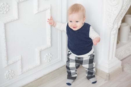 First steps of a ten month baby boyの写真素材