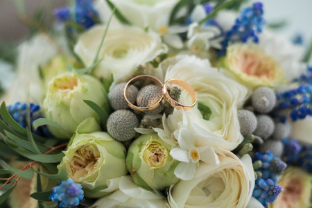 Two wedding rings and spring blossoms. Wedding concept.の写真素材