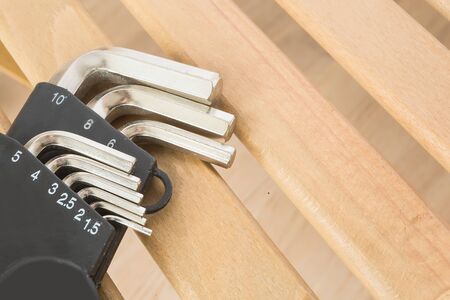 hex key hexahedron set on wood backgroundの写真素材