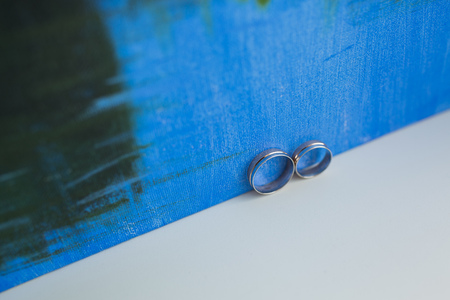 Two wedding rings and art pattern. Wedding concept.の写真素材