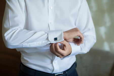 close up of a hand man wears white shirt and cufflinkの写真素材