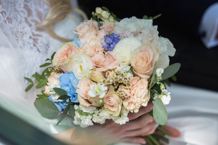 beautiful bouquet of bright white rose flowers, on table with grey backgroundの写真素材