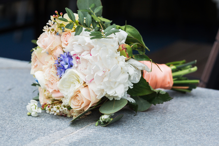 beautiful bouquet of bright white rose flowers, on table with grey backgroundの写真素材
