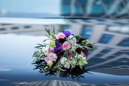 Colorful bridal pastel beautiful bouquet of different flowers. Wedding summer or spring bouquetの写真素材