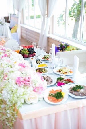 Beautiful pink and white flowers on table in wedding dayの写真素材