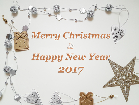 Top view of Christmas accessories on white background with Merry Christmas and happy new year text, flat layの写真素材