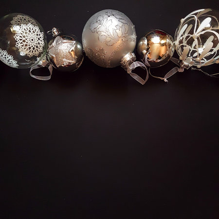 Christmas silver balls with ribbon on black background