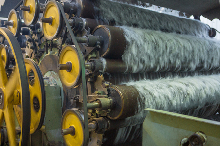 Manufacturing synthetic filler for the blankets. Machine or machine tool in the workshop production of blanketsの写真素材