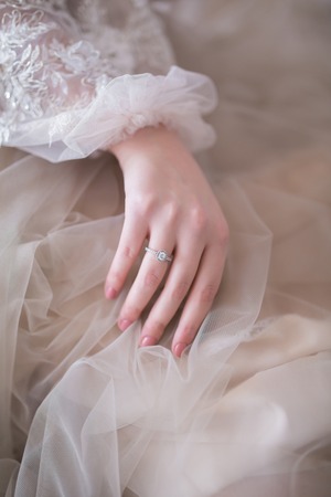 Close up of Beautiful bride in fashion wedding dress. Closeup beautiful fiancee portrait, young gorgeous bride.の写真素材