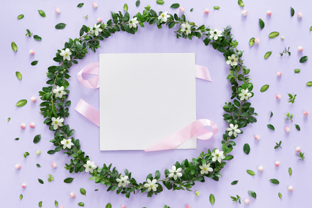 Flower and leaves frame wreath pattern background, flat lay, top viewの写真素材