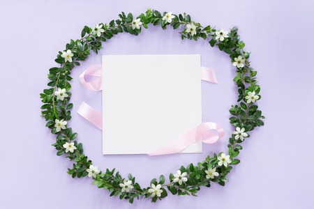 Flower and leaves frame wreath pattern background, flat lay, top viewの写真素材