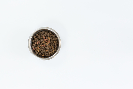 Dry dog food in metal bowl, top view and flat layの写真素材