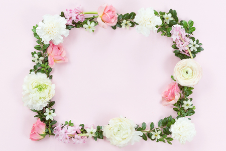 Flower and leaves frame wreath pattern background, flat lay, top viewの写真素材