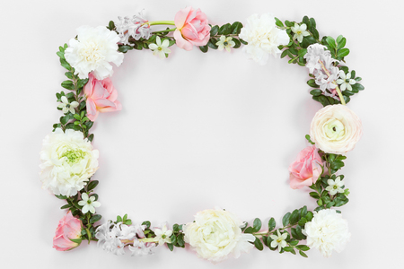Flower and leaves frame wreath pattern background, flat lay, top viewの写真素材