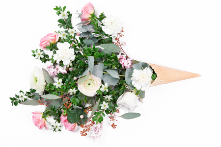 Top view of waffle cone with flowers bouquet on lilac or violet background, flat layの写真素材