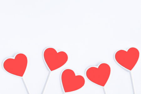 Group of vintage heart shaped chalkboards or signbaords living coral color with copy space in wooden frame isolated on white background, flat layの写真素材
