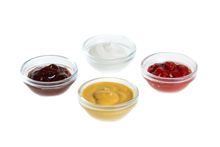Bowls with sauces isolated on white backgroundの写真素材
