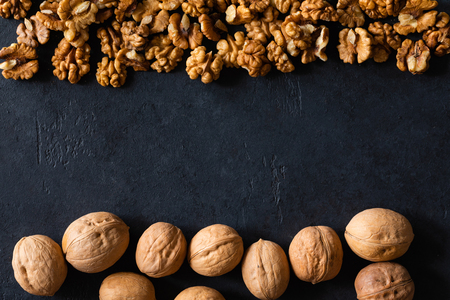 Natural walnut background pattern texture in-shell nuts, backdrop Walnuts in shell top viewの写真素材