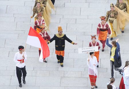 Warsaw, Poland - August 19, 2010 - Traditional dance team TETA from Indonesia - street parade during the International Folklore Festival WARSFOLK.のeditorial素材