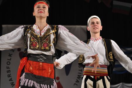 Warsaw, Poland - August 19, 2010 - The National Folklore Ensemble from Albania - performs folk dances during the International Folklore Festival WARSFOLK.のeditorial素材