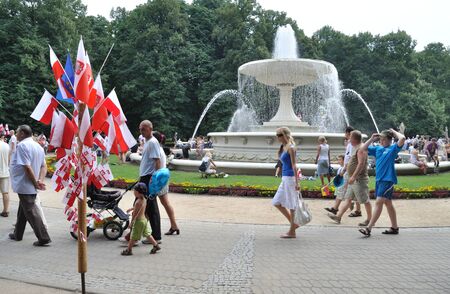 Warsaw, Poland - August 15, 2010 - People in a city park at the festivities of Polish Armed Forces Day.のeditorial素材