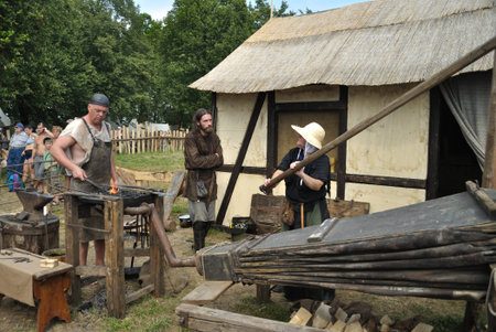 Grunwald, Poland - July 18, 2009 - Grunwald Show 2009 - reenactment of work in an old blacksmith shop.のeditorial素材