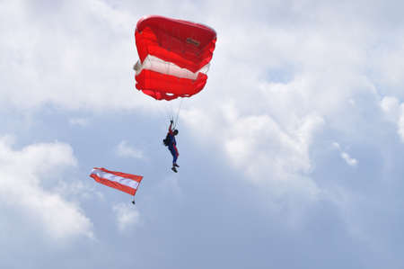 Radom, Poland - August 30, 2009 - Parachutist with the Austrian flag, during 11th Edition of the AIR SHOW.のeditorial素材