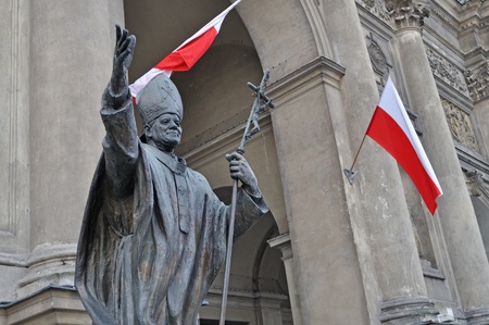 Warsaw, Poland - November 11, 2010 - Monument of pope John Paul II outside The Church of All Saints. It was unveiled on October 16, 1994, and was created by Italian sculptor Giorgio Galletti da Muggio.のeditorial素材