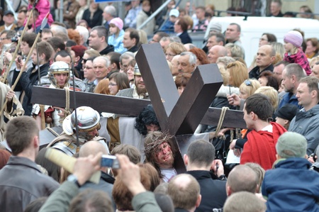 Gora Kalwaria, Poland - April 17, 2011 - Jesus carrying his cross, on the way to his crucifixion, during the street performances Mystery of the Passion.のeditorial素材