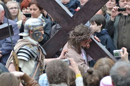 Gora Kalwaria, Poland - April 17, 2011 - Jesus carrying his cross, on the way to his crucifixion, during the street performances Mystery of the Passion.のeditorial素材