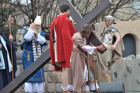 Gora Kalwaria, Poland - April 17, 2011 - Jesus carrying his cross, on the way to his crucifixion, during the street performances Mystery of the Passion.のeditorial素材
