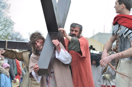 Gora Kalwaria, Poland - April 17, 2011 - Jesus carrying his cross, on the way to his crucifixion, during the street performances Mystery of the Passion.のeditorial素材