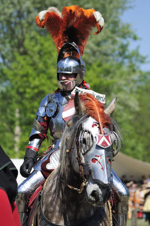 Warsaw, Poland - May 03, 2012 - Knight in jousting armor, mounted on horse during the International...