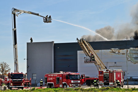 Wolka Kosowska, Poland - May 10, 2011 - Firefighters extinguish a raging fire in a China Mart...